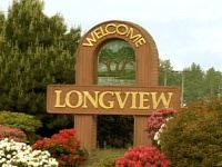 Welcome to Longview road sign with flowers